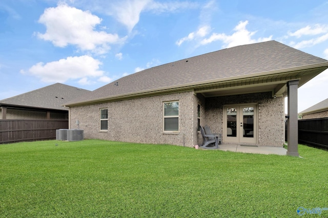 103 Barlow Way, Owens Cross Roads, AL 35763 - back of property featuring french doors, a fenced backyard, brick siding, a patio area, and a shingled roof