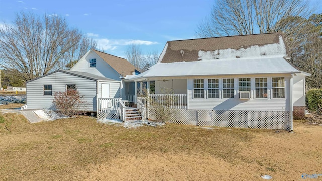 back of house with a lawn