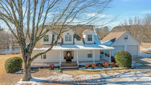 view of front facade featuring covered porch and a garage