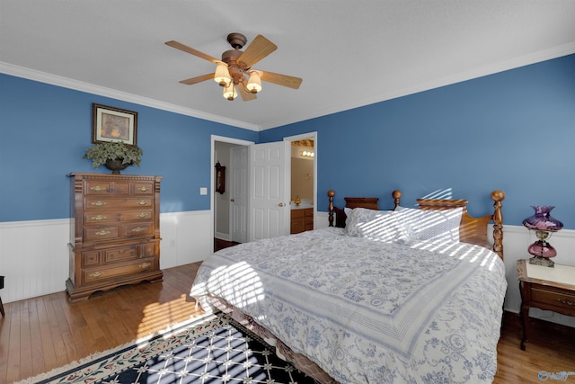 bedroom featuring ceiling fan, wood-type flooring, and crown molding