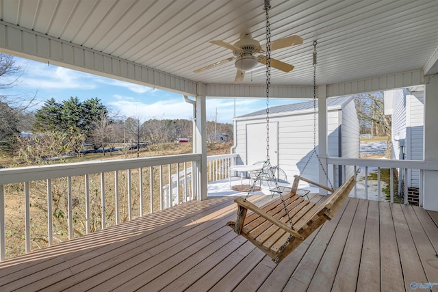 wooden deck featuring ceiling fan