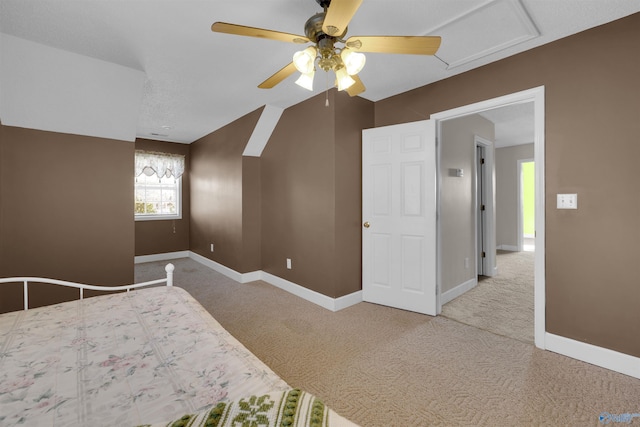 unfurnished bedroom featuring ceiling fan and carpet