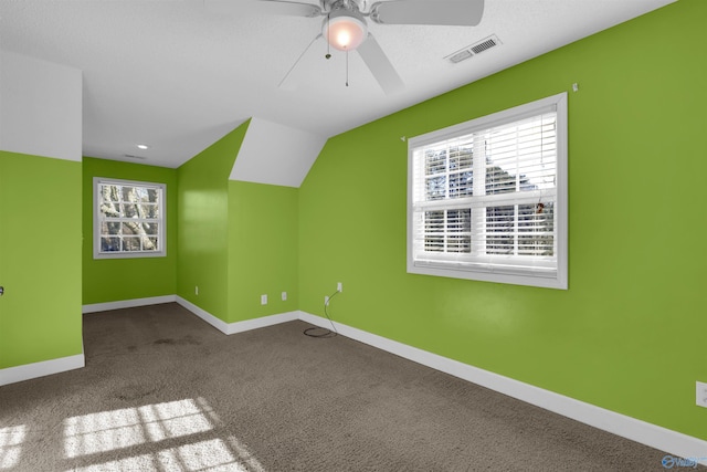 bonus room with ceiling fan, carpet flooring, and lofted ceiling