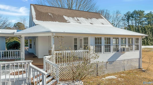 rear view of property with covered porch