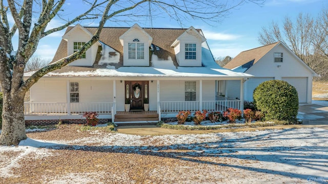 farmhouse featuring a garage and a porch