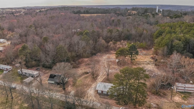 drone / aerial view featuring a forest view