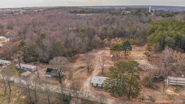 birds eye view of property with a view of trees