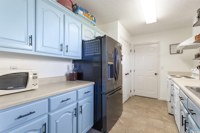 kitchen featuring blue cabinets, white appliances, a textured ceiling, and ventilation hood