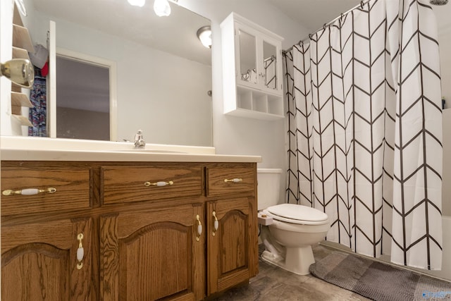 bathroom featuring vanity, curtained shower, and toilet