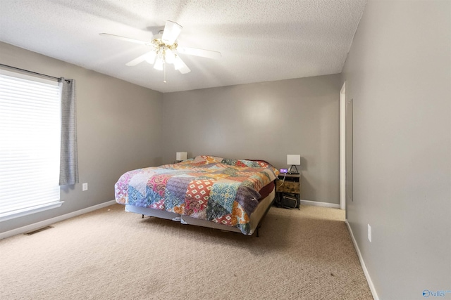 bedroom featuring visible vents, baseboards, and carpet