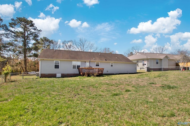 back of house with crawl space, a yard, a fenced backyard, and a wooden deck