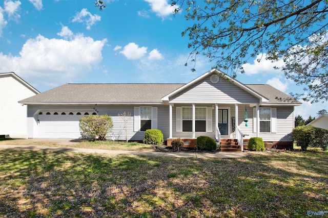 view of front of home featuring a shingled roof, a front lawn, covered porch, crawl space, and an attached garage