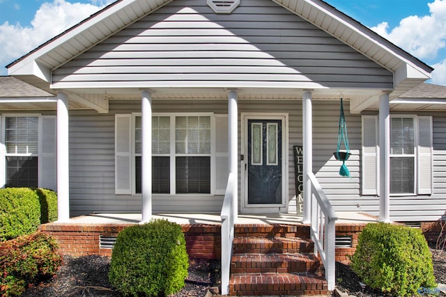 doorway to property featuring a porch