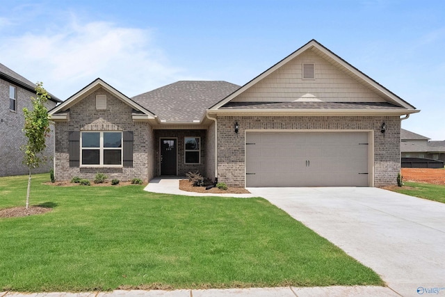 craftsman-style home featuring a garage and a front yard