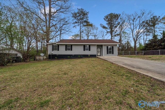 view of front of house with a front yard, driveway, crawl space, and fence