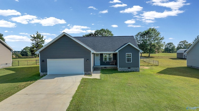 view of front of house with a front yard and a garage