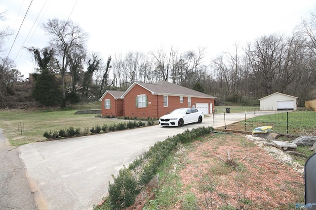 exterior space featuring a garage, a yard, and crawl space