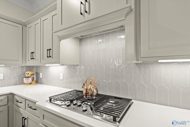 kitchen featuring decorative backsplash and stainless steel gas stovetop