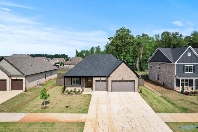 127 Parkland Hill Trce, Madison, AL 35756 - view of front of property with brick siding, a front lawn, an attached garage, and driveway