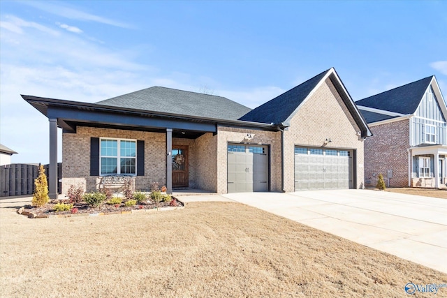 view of front of house featuring a garage and a porch