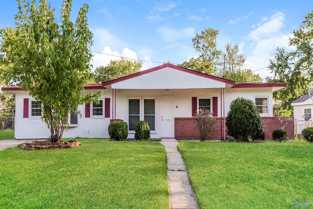 ranch-style house with a front lawn