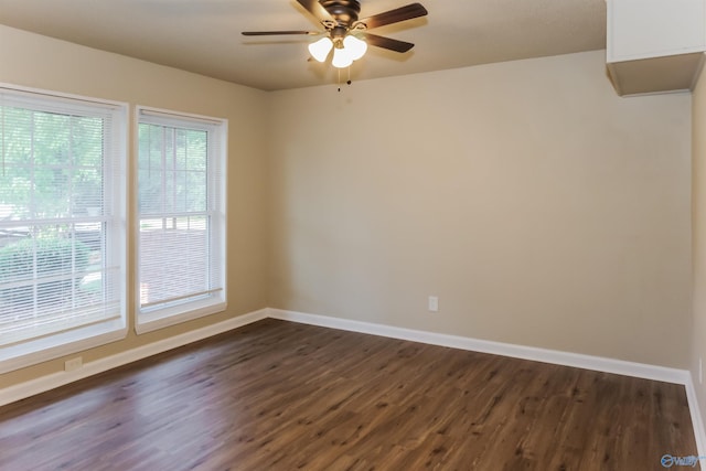 unfurnished room featuring ceiling fan and dark hardwood / wood-style flooring