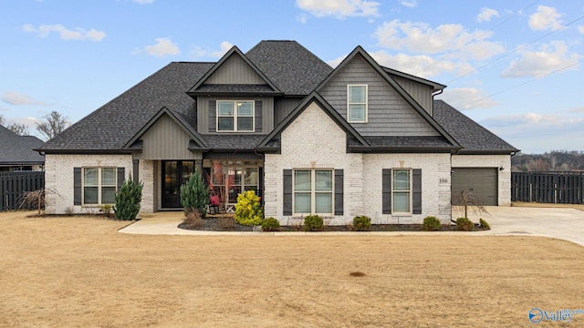 craftsman house featuring a front yard and a garage