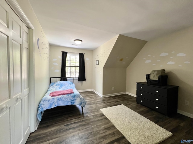 bedroom featuring visible vents, baseboards, and dark wood-style floors