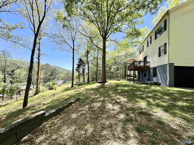 view of yard featuring a wooden deck