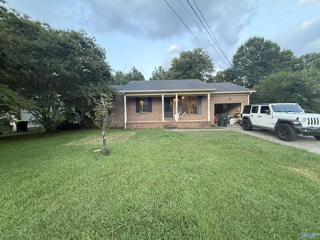 1714 Wilshire Ave SW, Decatur, AL 35603 - single story home with brick siding, a front yard, concrete driveway, and an attached garage