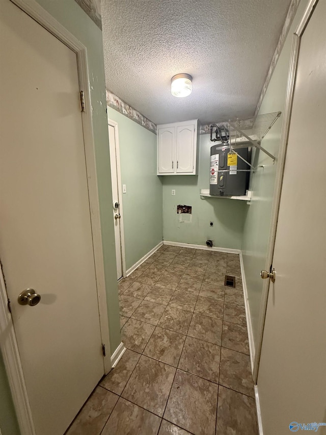 1714 Wilshire Ave SW, Decatur, AL 35603 - washroom featuring water heater, cabinet space, hookup for a washing machine, electric dryer hookup, and a textured ceiling