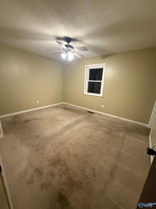 1714 Wilshire Ave SW, Decatur, AL 35603 - carpeted empty room featuring a ceiling fan and a textured ceiling