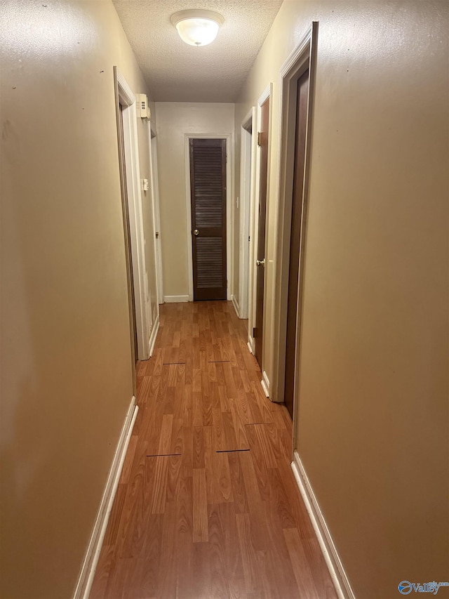 1714 Wilshire Ave SW, Decatur, AL 35603 - hallway featuring wood finished floors and baseboards