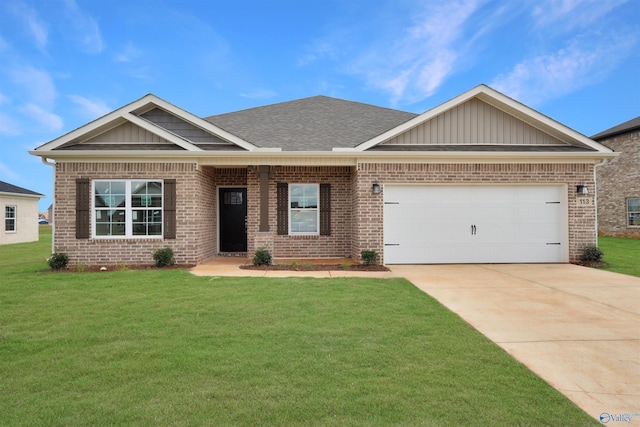 craftsman house with a front yard and a garage