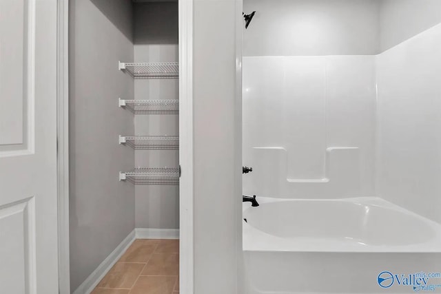 bathroom with shower / tub combination and tile patterned floors