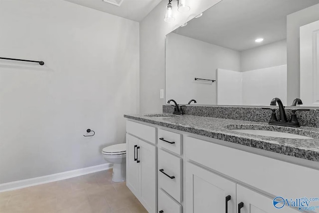 bathroom with a shower, tile patterned floors, vanity, and toilet