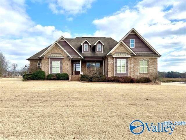 craftsman-style home with a front lawn