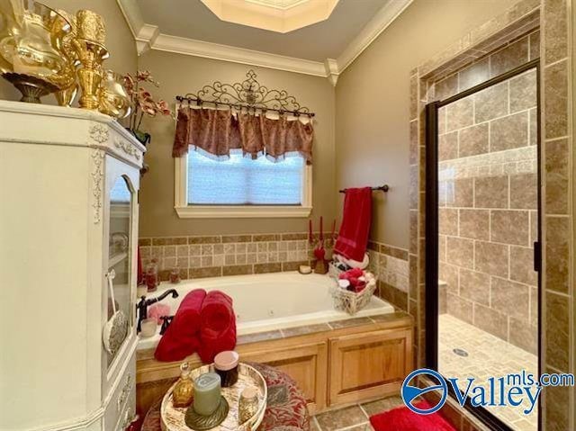 bathroom with plus walk in shower, tile patterned floors, and ornamental molding