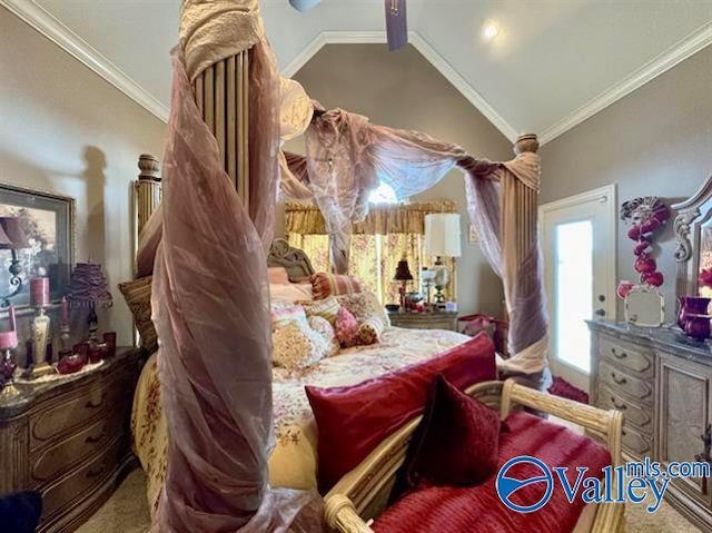 bedroom with lofted ceiling and ornamental molding