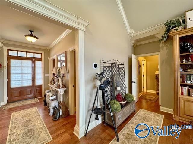 entryway featuring hardwood / wood-style flooring and crown molding