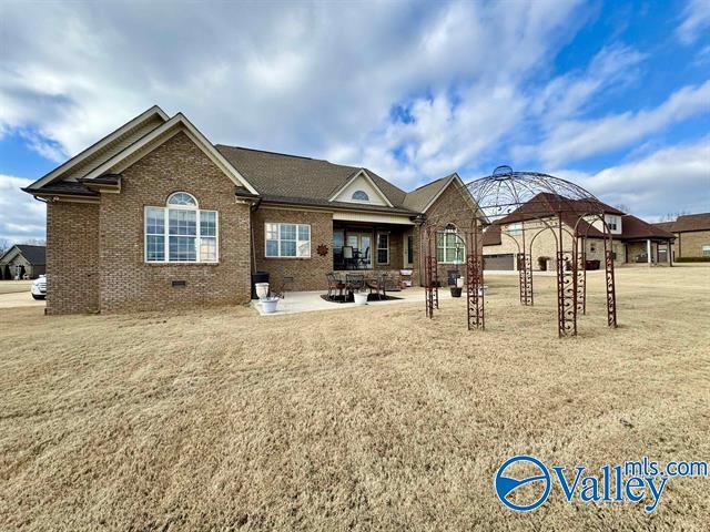 rear view of property with a gazebo and a patio area