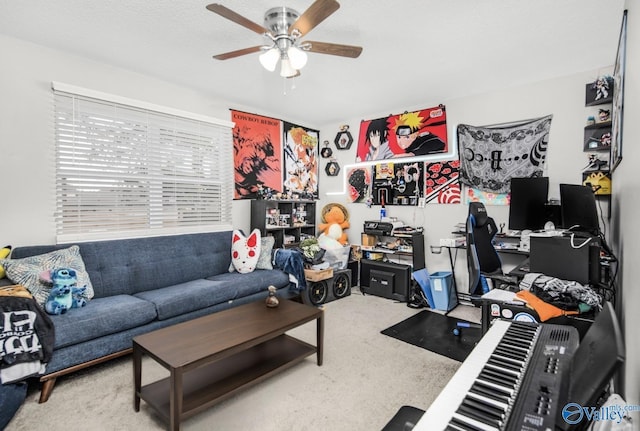 home office featuring a ceiling fan and carpet floors