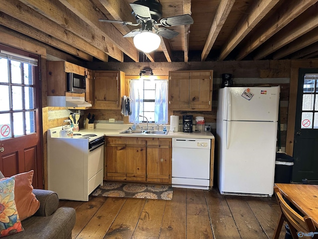 kitchen with white appliances, dark wood-style flooring, a sink, light countertops, and beam ceiling