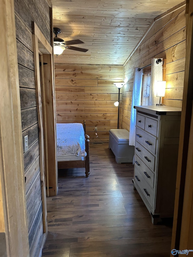 unfurnished bedroom featuring wooden ceiling, wood walls, dark wood-style flooring, and lofted ceiling