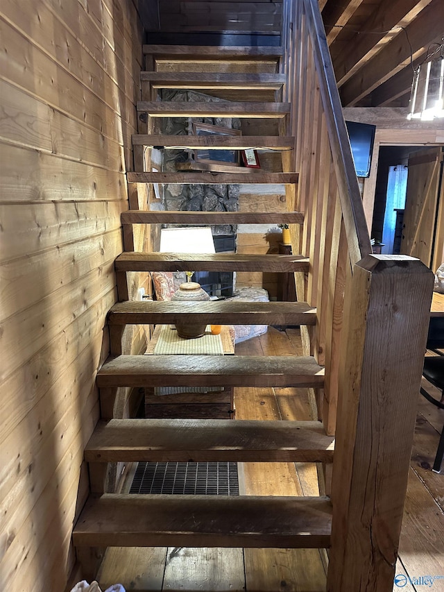 staircase with wooden walls