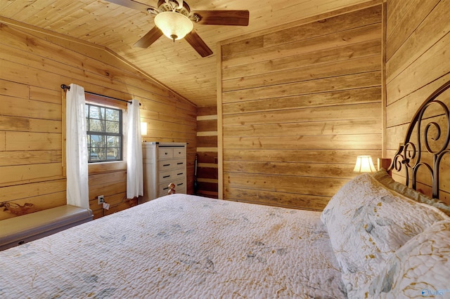 unfurnished bedroom with wood ceiling, wooden walls, vaulted ceiling, and a ceiling fan