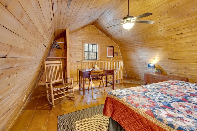 bedroom featuring lofted ceiling, wood walls, wood ceiling, and hardwood / wood-style flooring