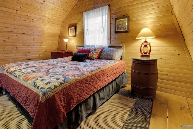 bedroom featuring lofted ceiling and wood walls