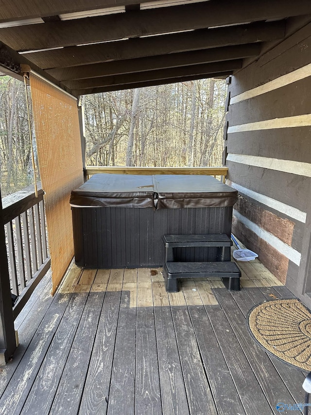 deck with a hot tub