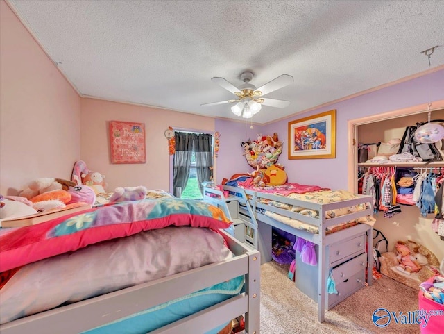 812 Mitwede St SW, Hartselle, AL 35640 - carpeted bedroom featuring a textured ceiling, a ceiling fan, and a closet